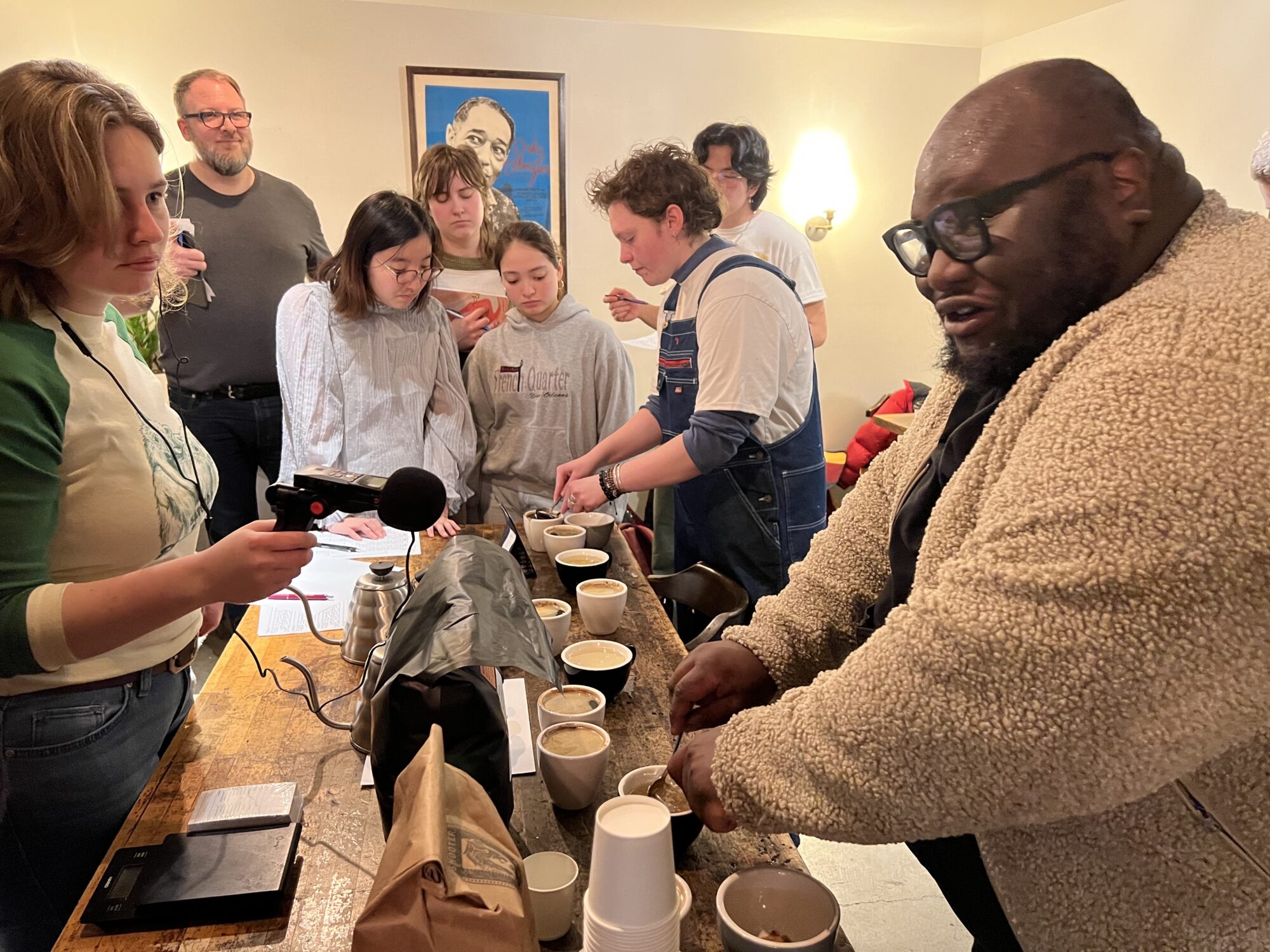 Ezra Baker teaching students how to prepare a coffee tasting.