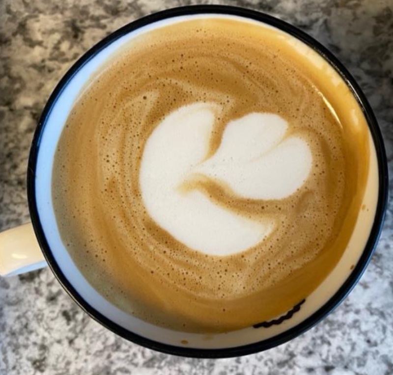 Mug with blocky 2-layer tulip latté art done by me with at-home equipment and oat milk.