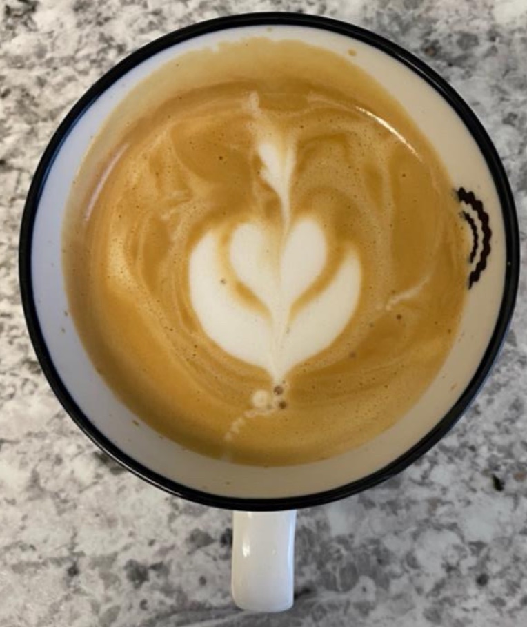 Mug with 3-layer tulip latté art done by me with at-home equipment and oat milk.