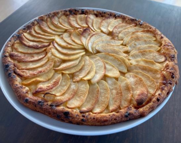 Classic Thin Apple Tart placed in a plate on the table