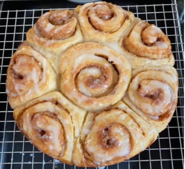 Cinnamon rolls on a baking rack