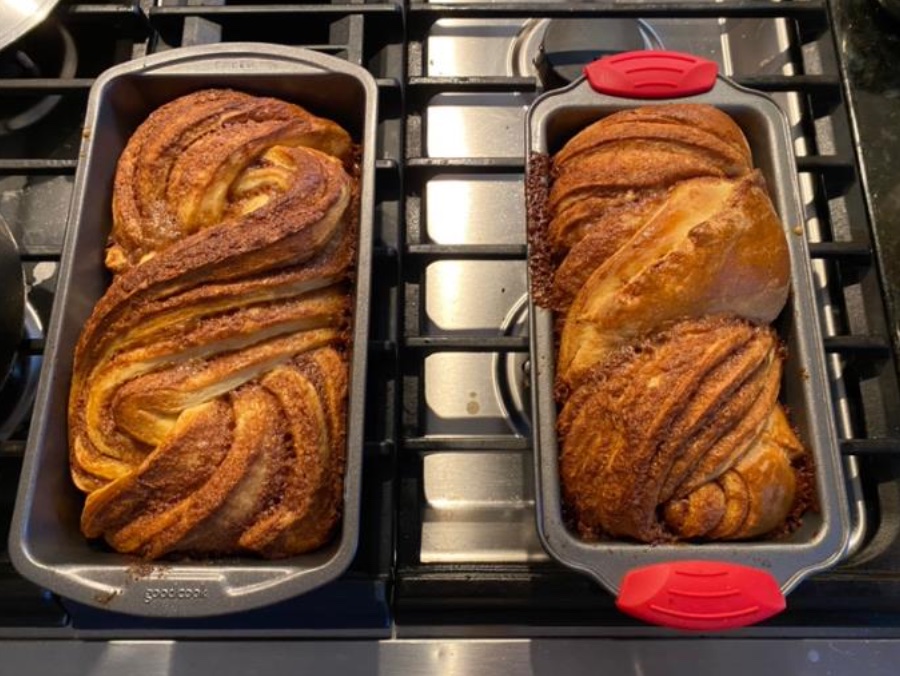 Two sinnamon bakkas, placed side by side on a bake tray